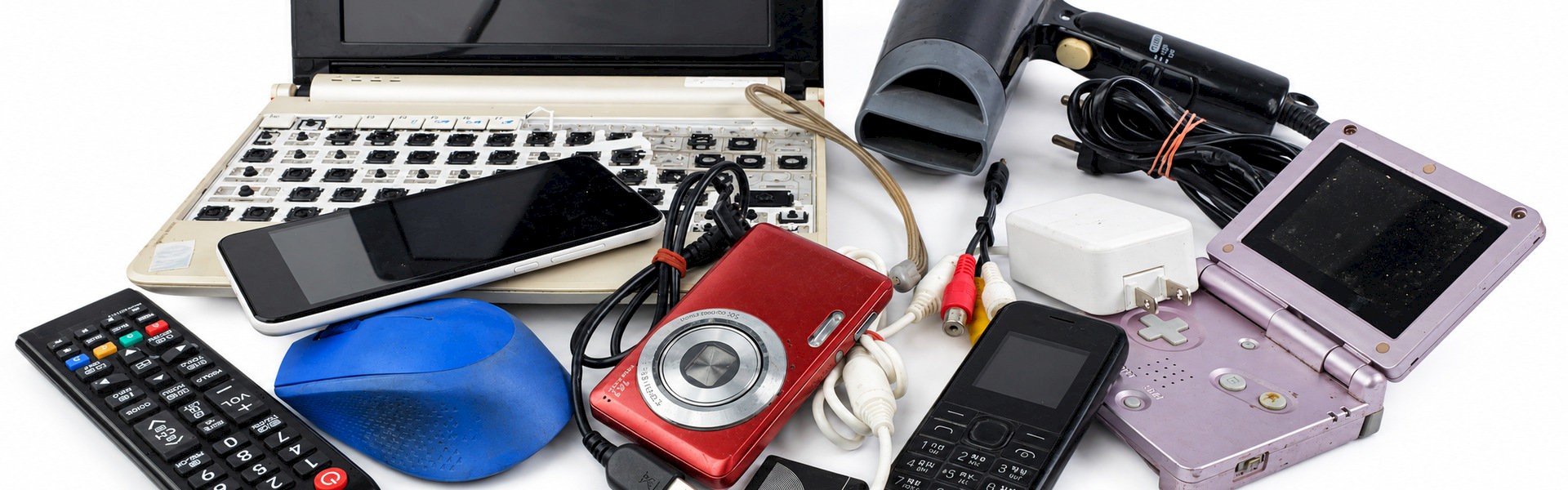 Discarded electronics track and traced on the Klean Loop blockchain including a laptop, mobile phones, digital camera, handheld game console and cables awaiting recycling.