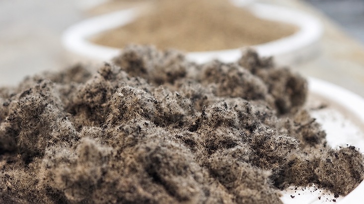 Recovered tire textile fibers investigated for use as reinforcement in concrete.