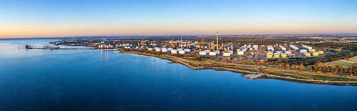Aerial view of Viva Energy’s Geelong refinery, storage tanks and waterfront in Australia.