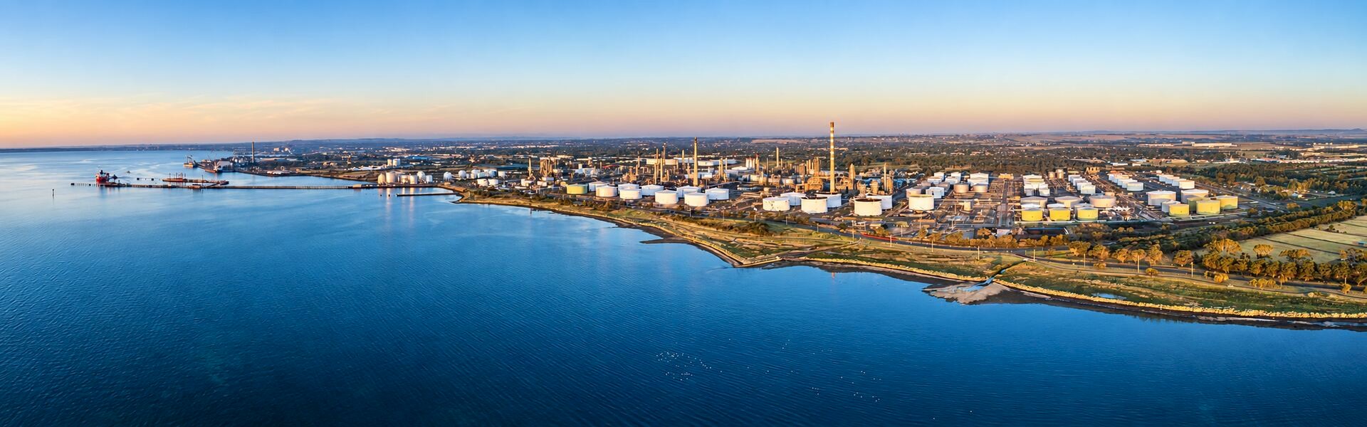 Aerial view of Viva Energy’s Geelong refinery, storage tanks and waterfront in Australia.